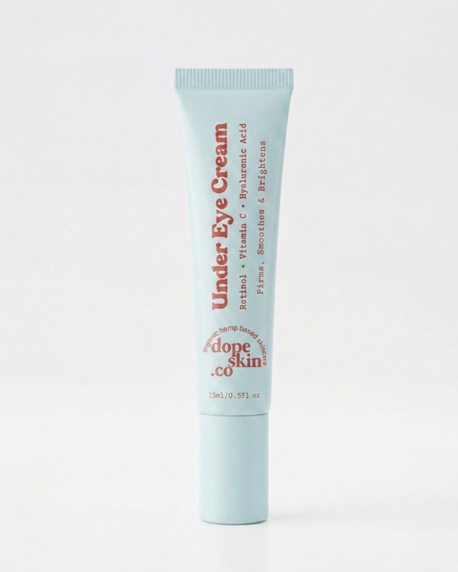 A light blue squeeze tube of Dope Skin Retinol Under Eye Cream with red text, centered on a clean white background.